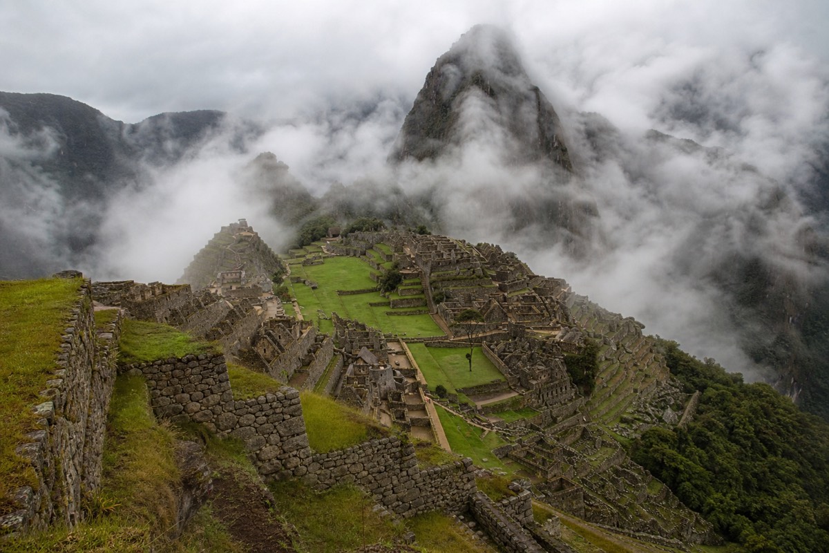Cloud drifting over the Machu Picchu citadel, which changes a lot by season